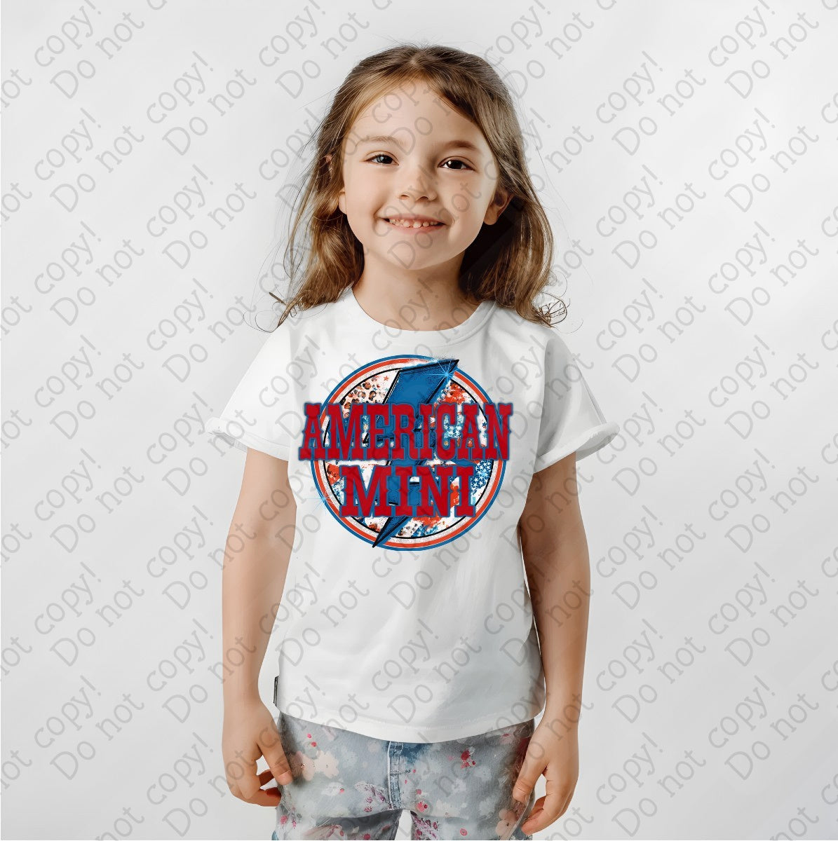 07-128 American Mini in red font with a blue lighting bolt Colored Tee