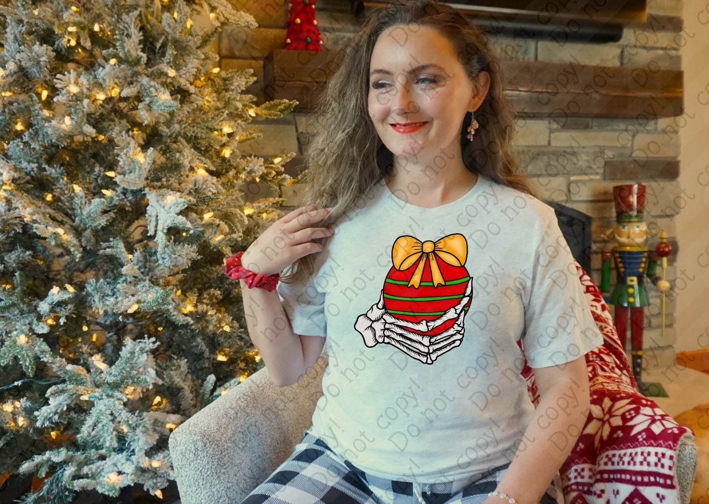 12-527 Skeleton Hand With Ornament tee