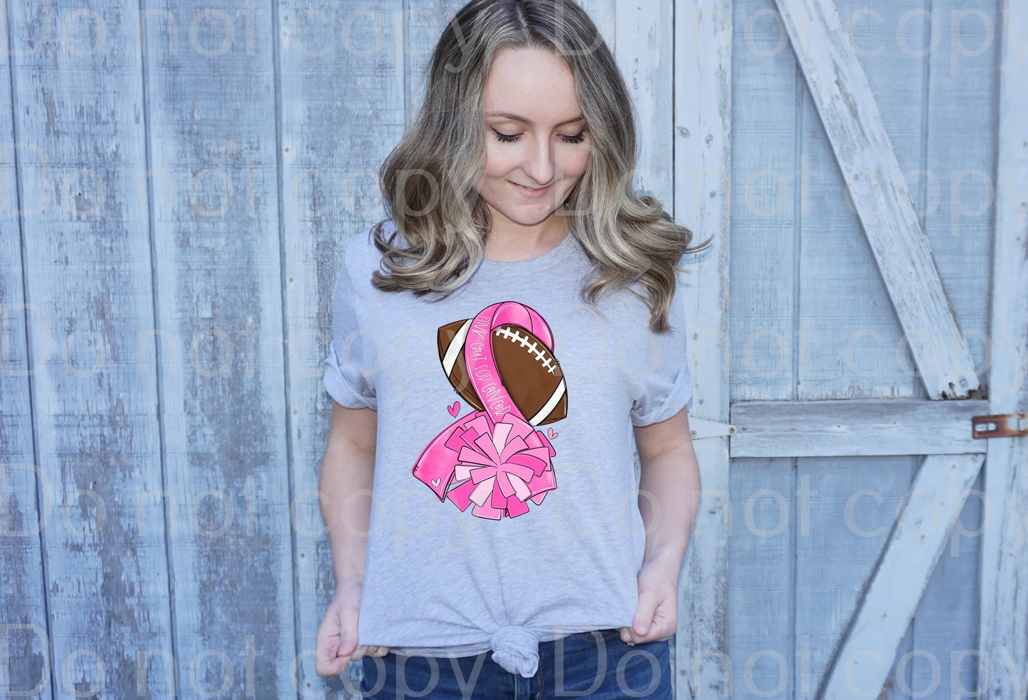 45-62 Breast cancer ribbon football with pom poms Completed Tee